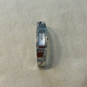 Bulova water resistant steelback watch. Mother of pearl face w rhinestones 6.24”
